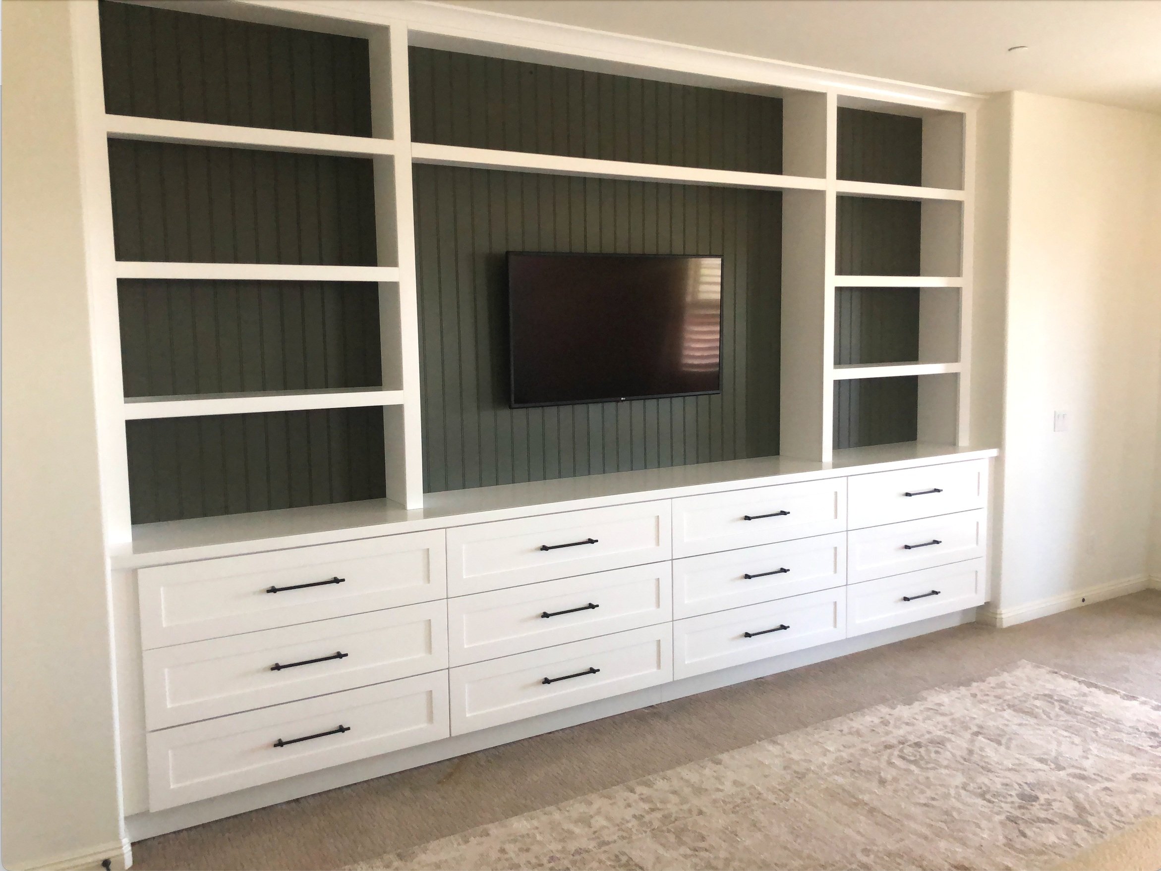 Custom built-in entertainment center with white cabinetry